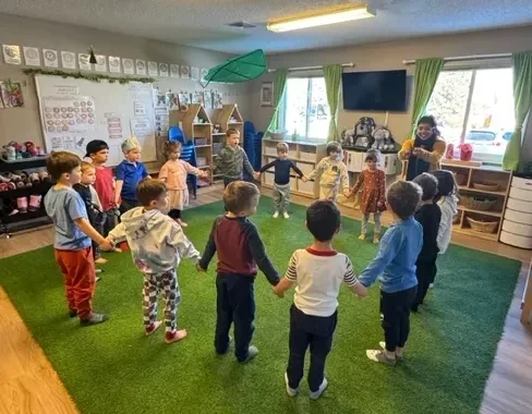 Children playing together during an indoor group activity
