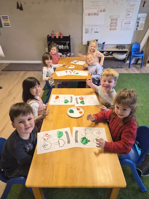 Children coloring together during a classroom art activity