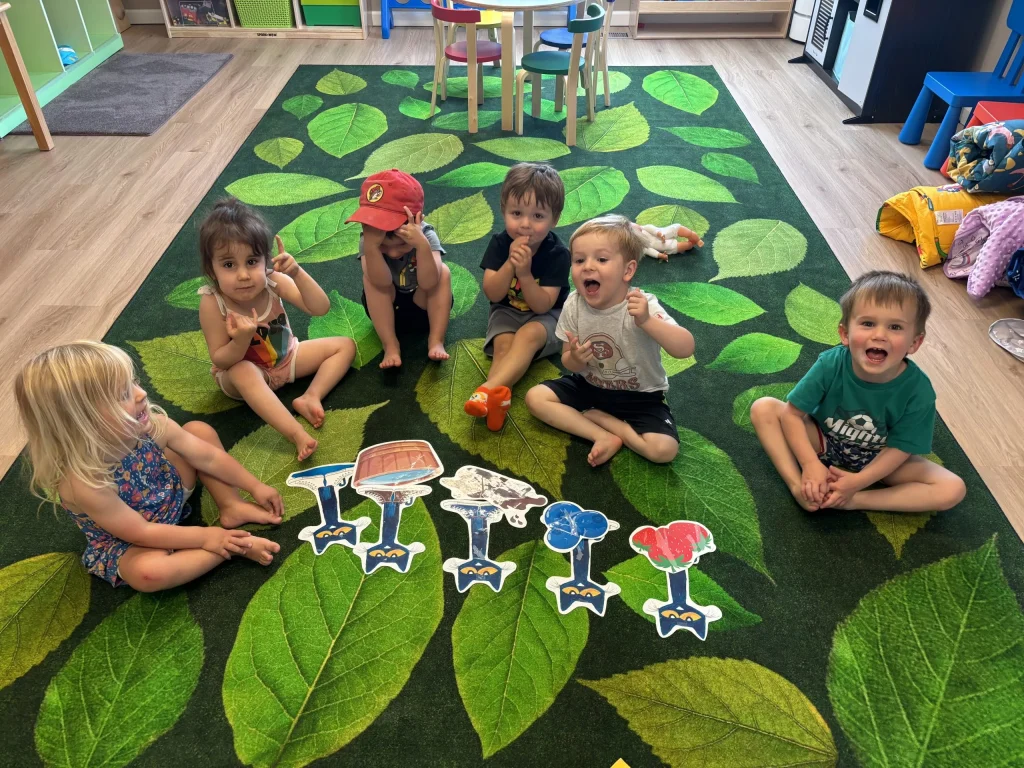 Children laughing and smiling during a group activity