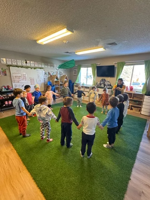 Children playing together during an indoor group activity
