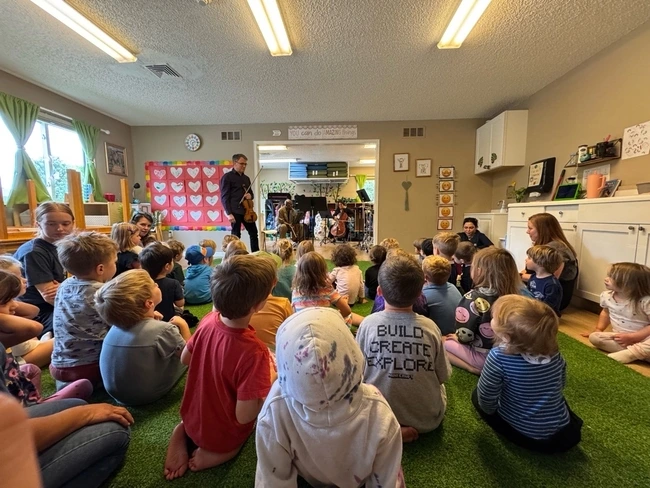 Children participating in a music study activity
